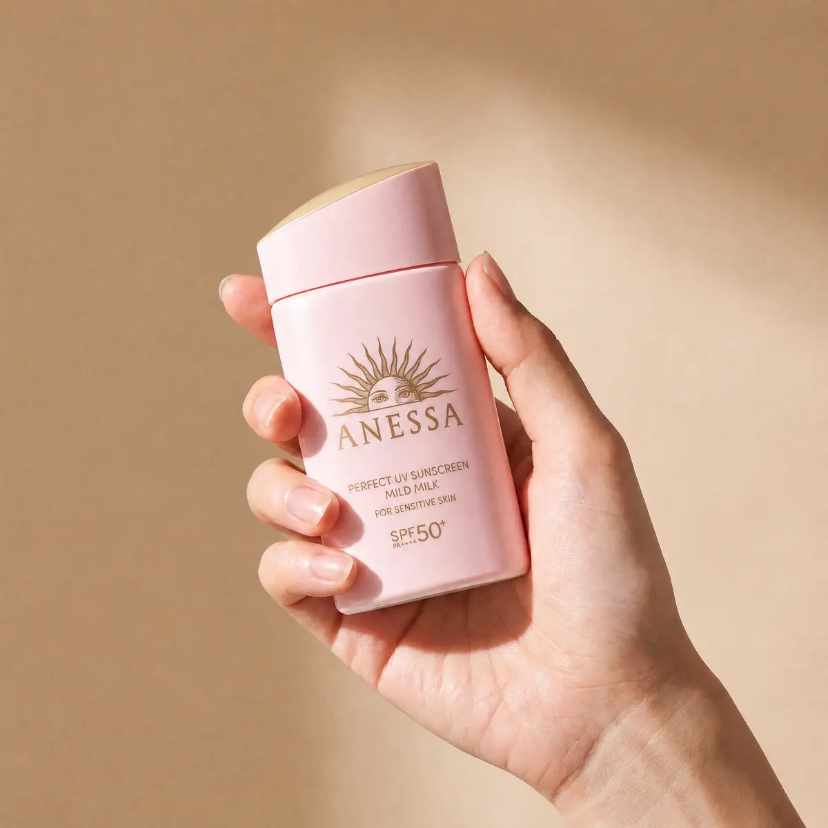 Anessa Perfect UV Sunscreen Mild Milk NA 60ml held in hand